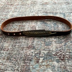 Moss Mills leather belt with bronze feather clasp.